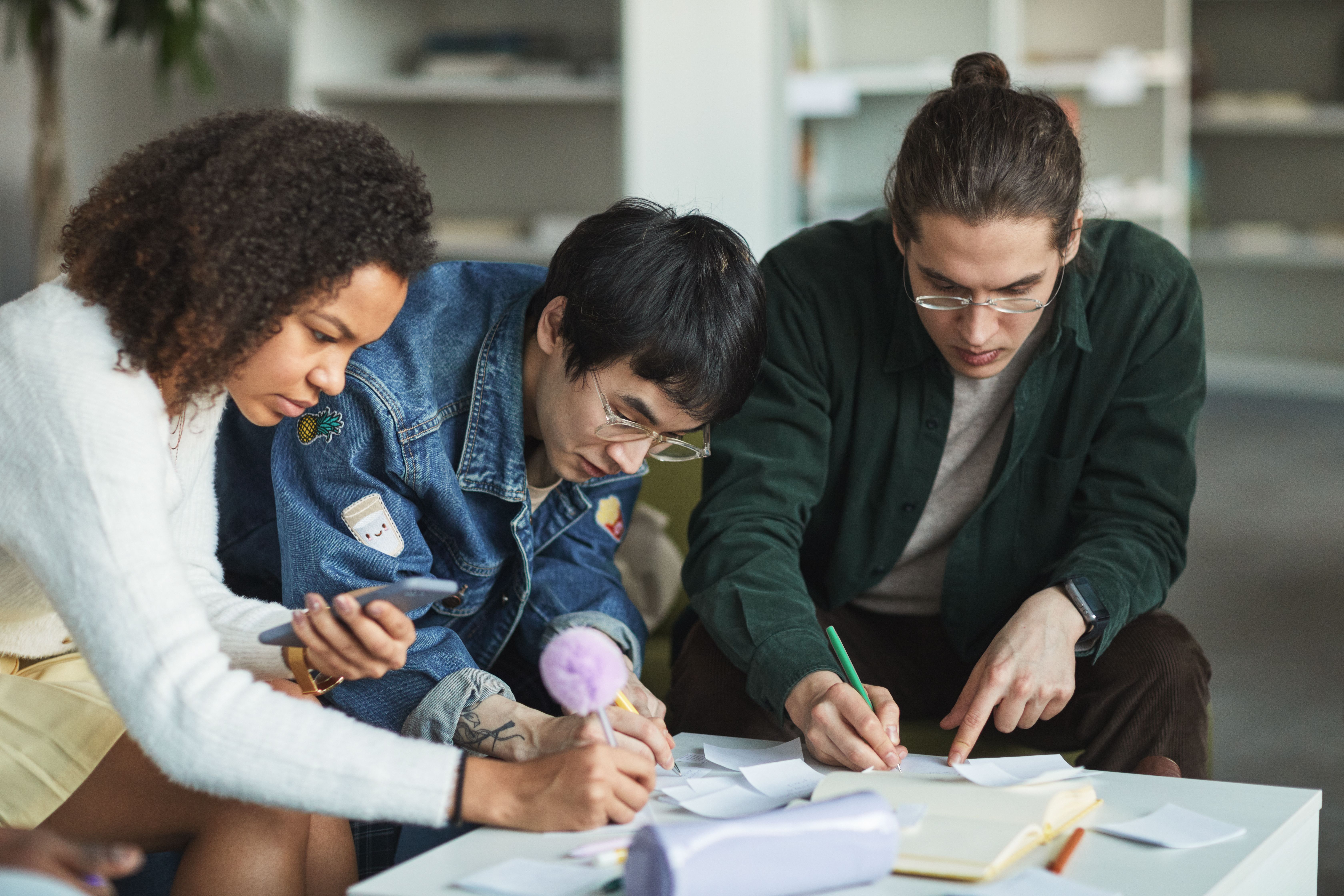 Small group studying together in a library